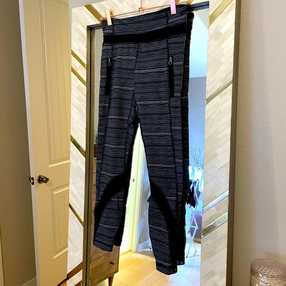 Grey and black striped lululemon leggings with sheer cutouts size 4